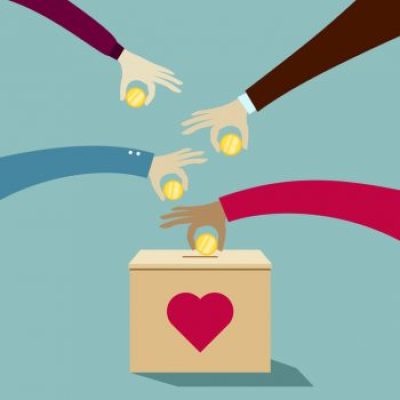 Hands puting coins into donation box: Donate money charity concept